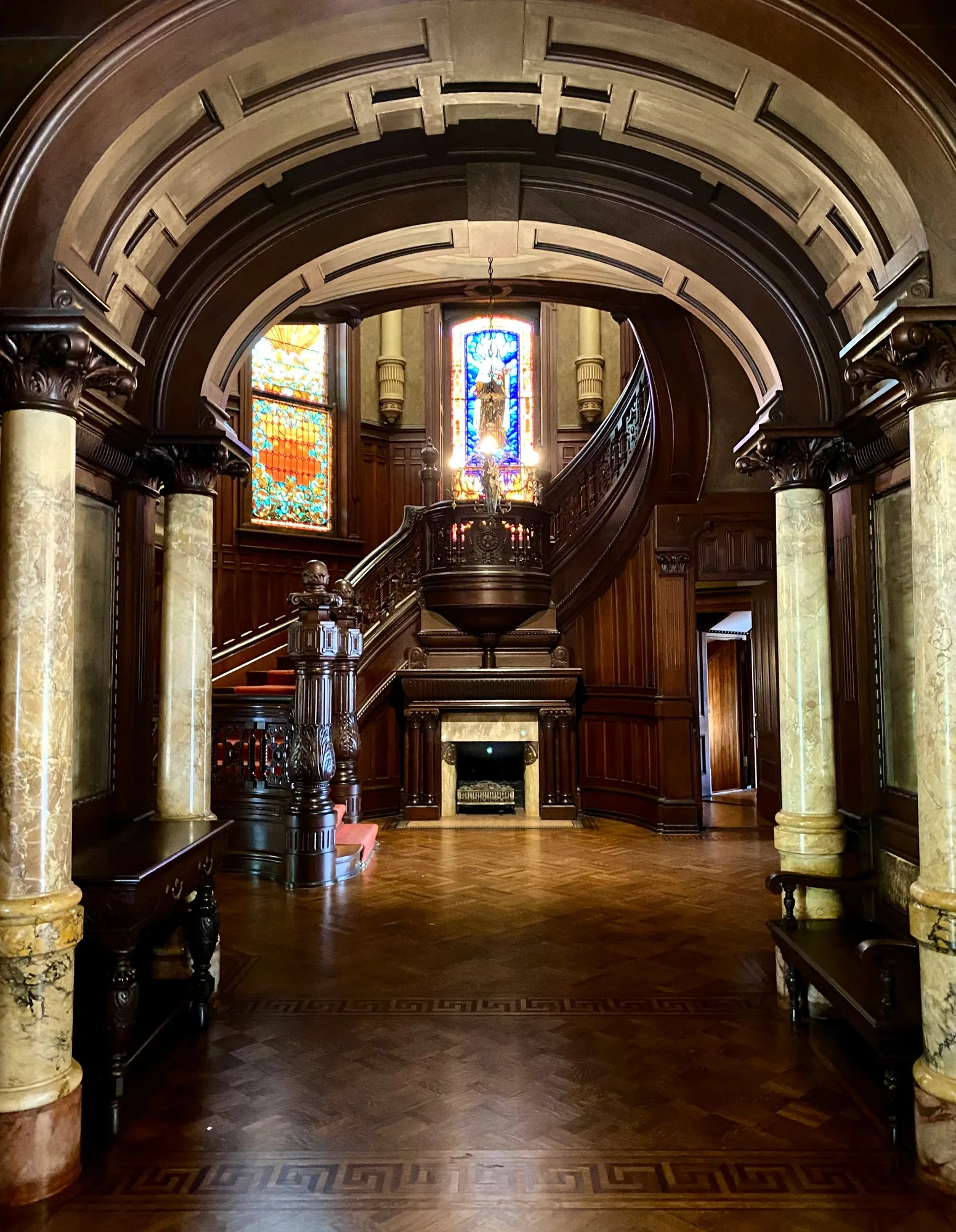 The main hall and rotunda staircase inside Bishop’s Palace