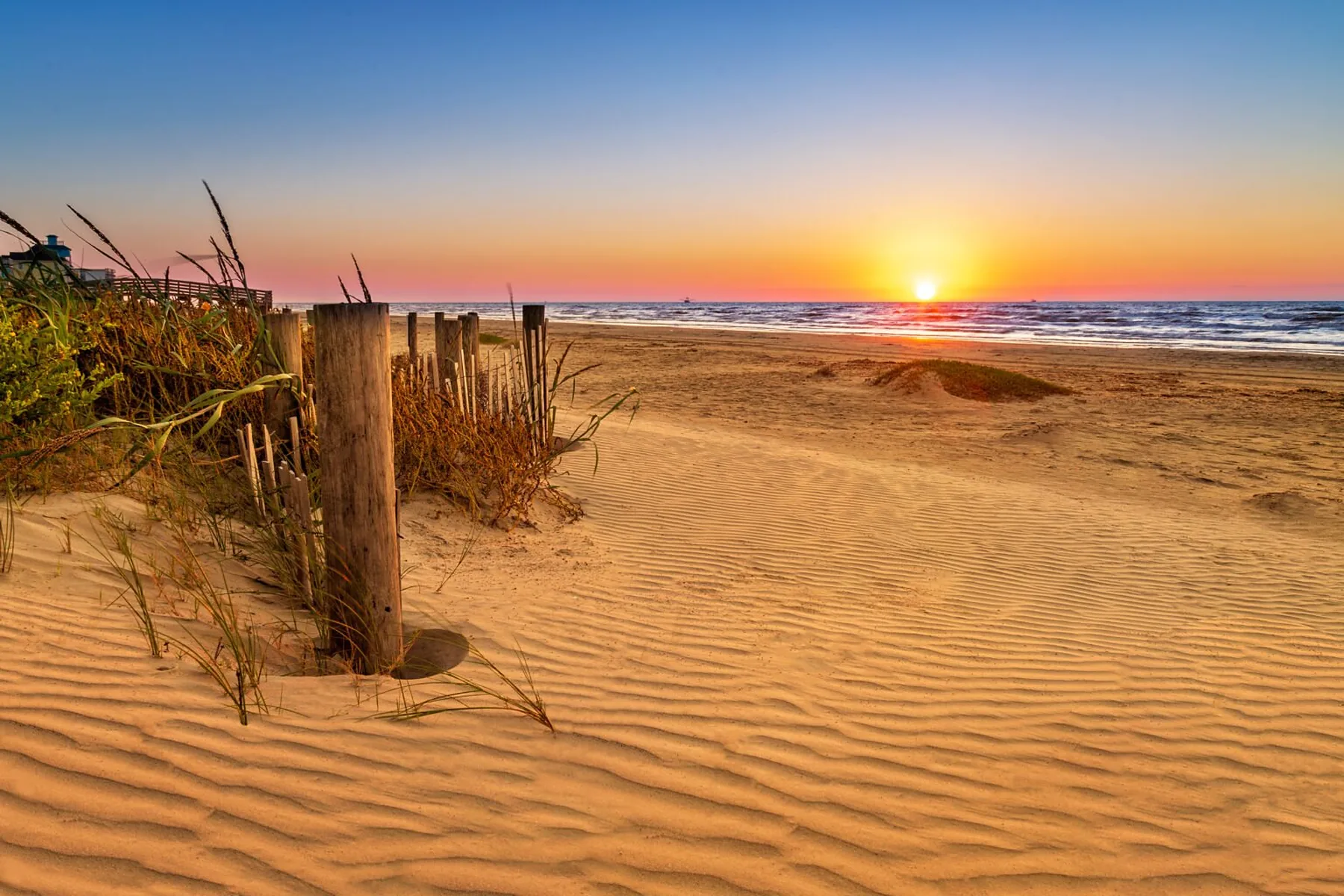 Warm sunrise light over the beach and the Gulf