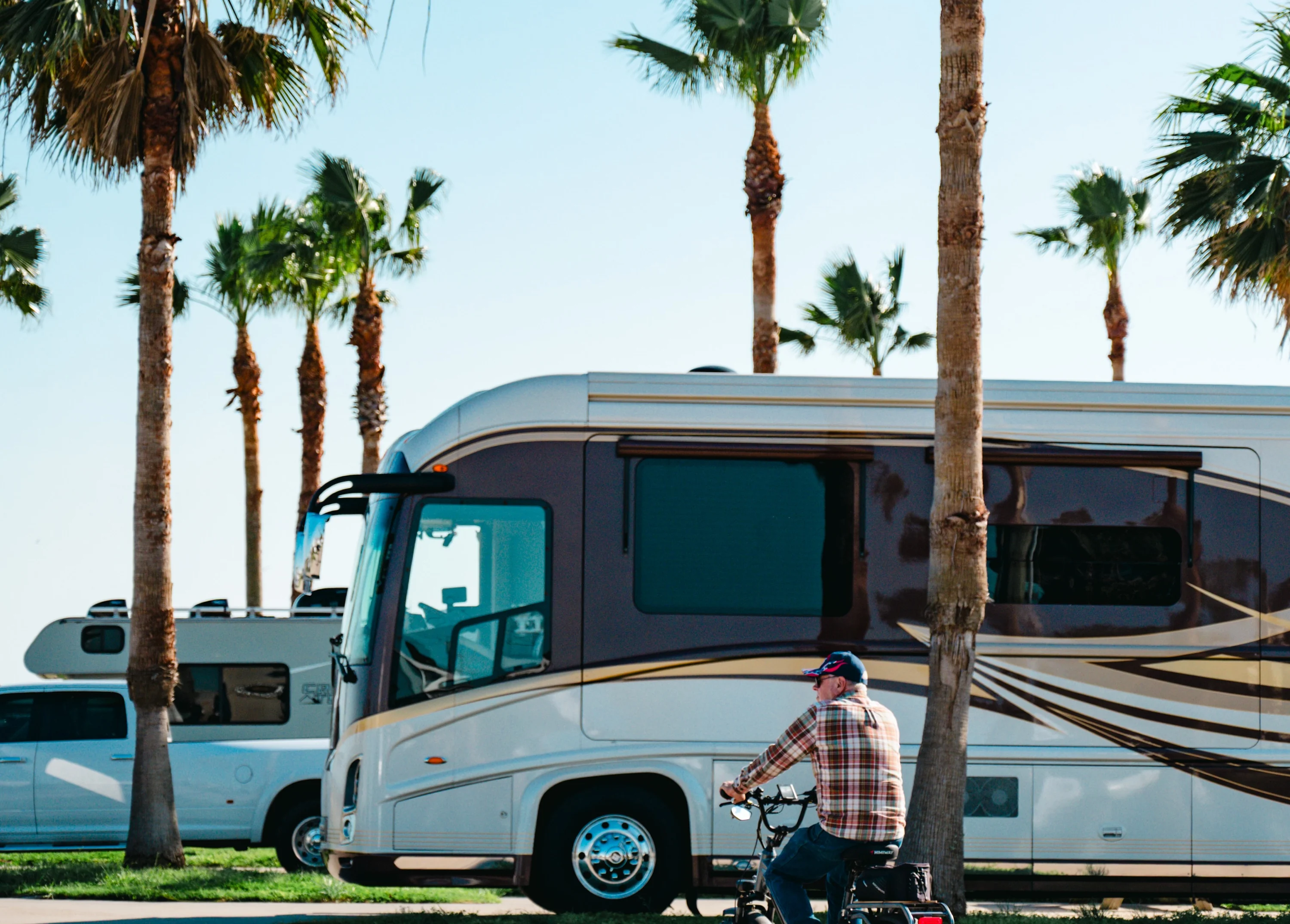 A motorhome under the palms on a premium site