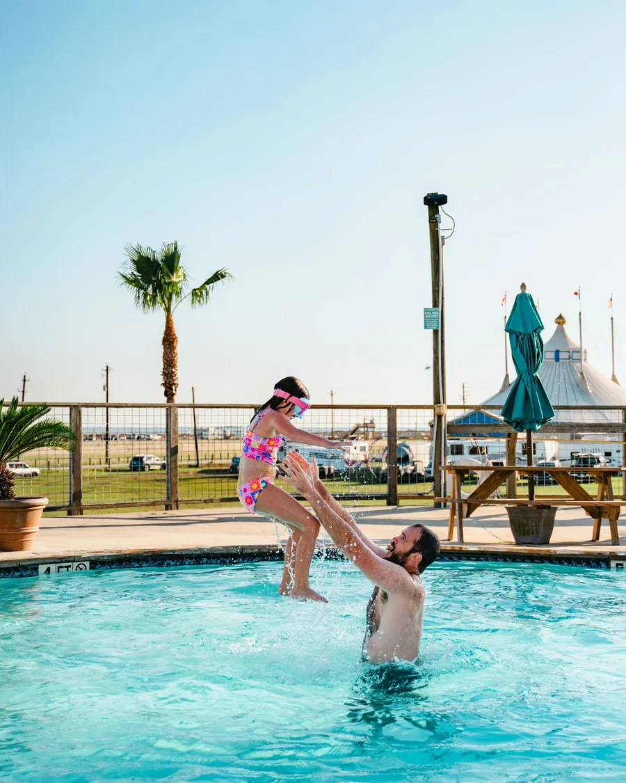 A family enjoying the resort pool together