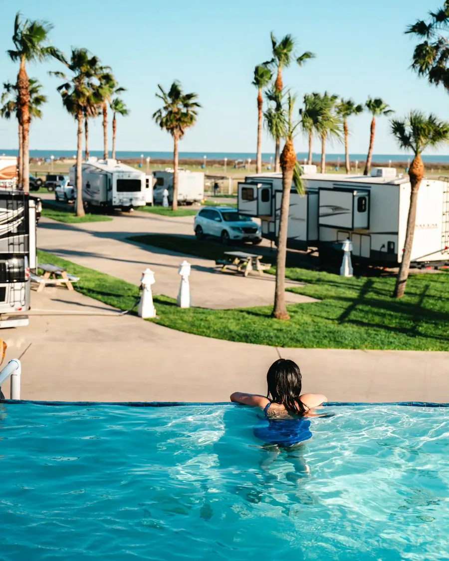 The pool and RV sites with palms and the Gulf beyond